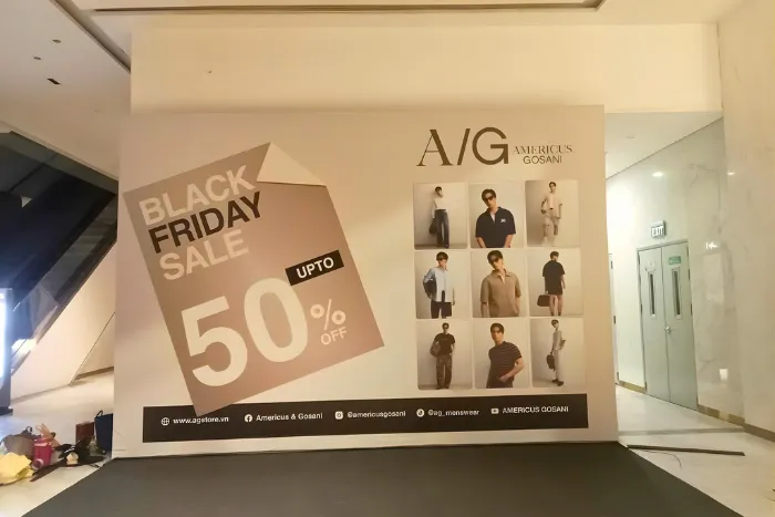 Mẫu backdrop check in black friday sale của A/G Americus Gosani