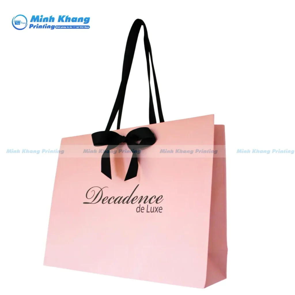 Mẫu túi giấy có nơ cho shop thời trang đen hồng giấy couche