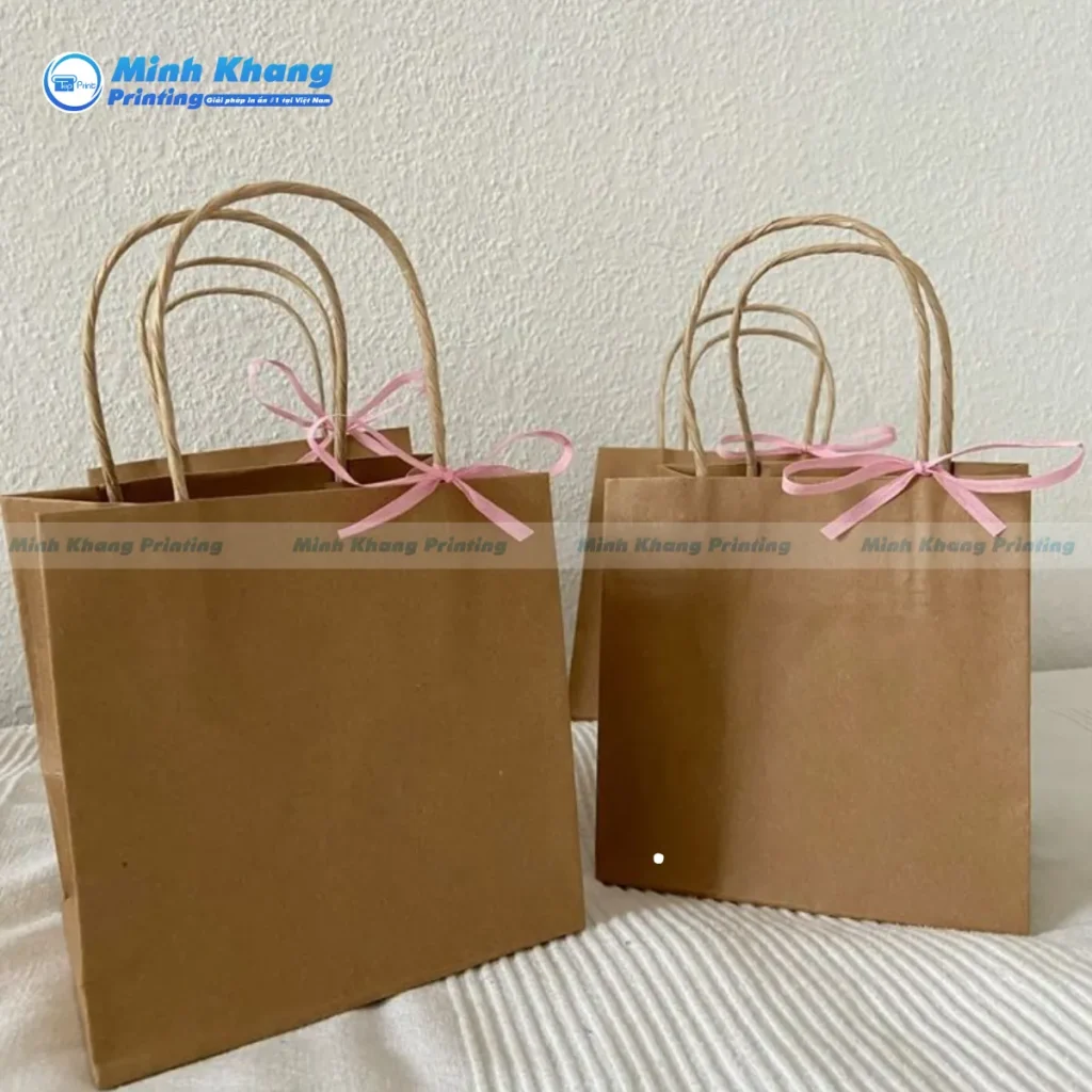 Mẫu túi giấy có nơ làm quà tặng giấy Kraft nâu đơn giản 