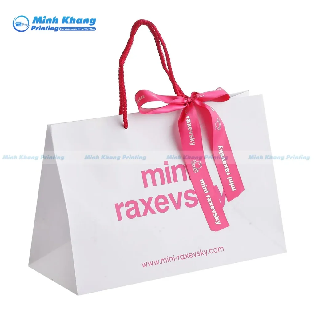 Mẫu túi giấy có nơ đựng quà màu trắng 