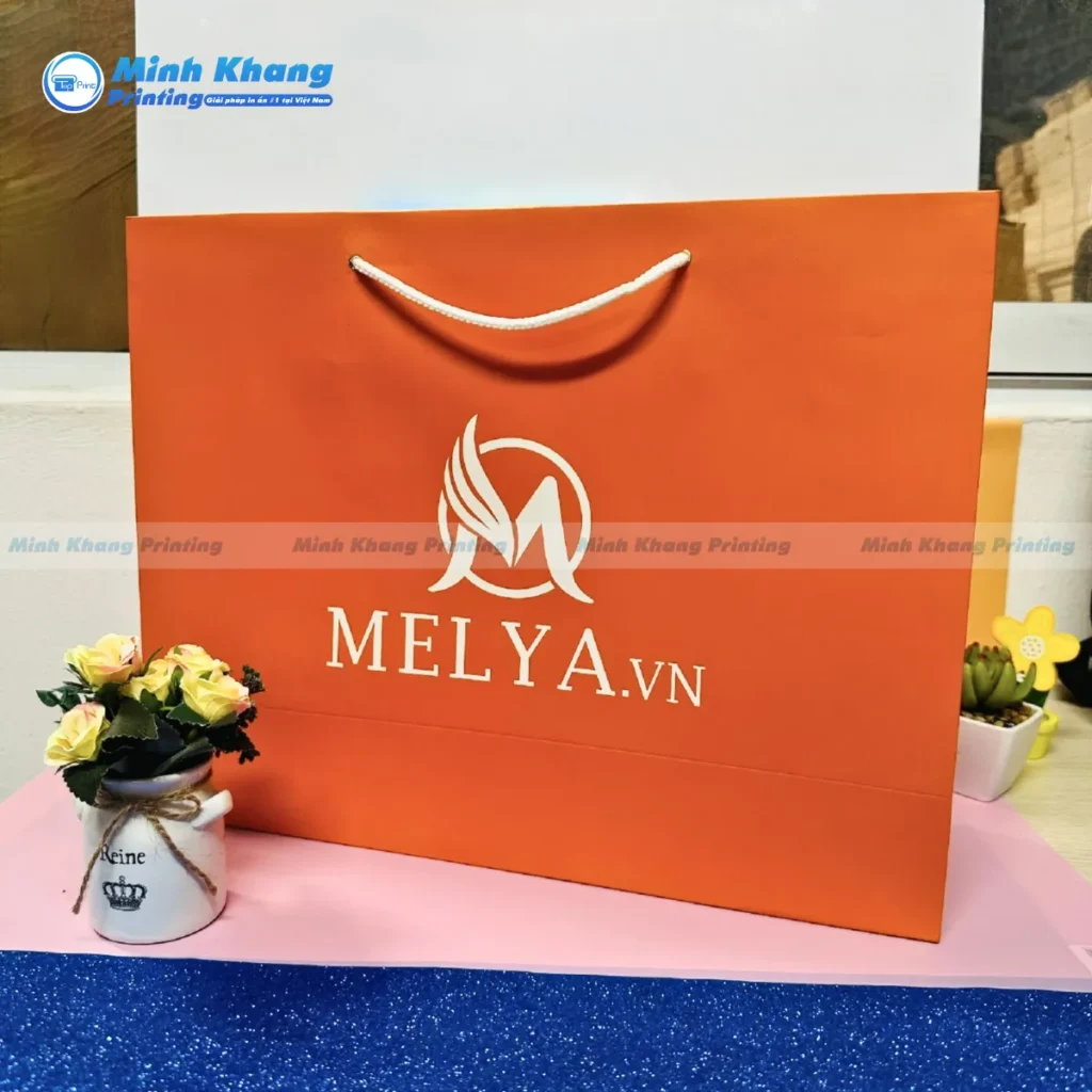 Mẫu túi giấy cam in logo MELYA.vn ép kim sang trọng