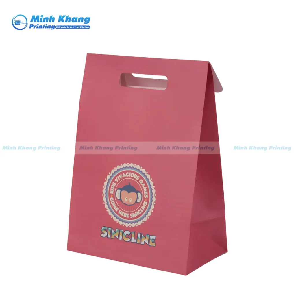 Mẫu túi giấy khoét quai màu hồng đựng bánh kẹo